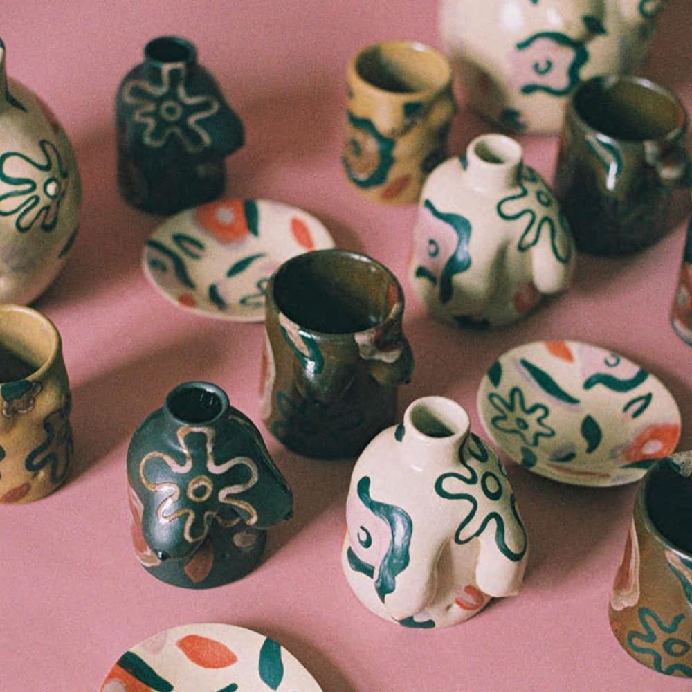 Selection of pottery on a pink table