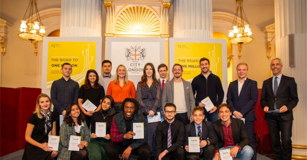 A group of young people holding certificates that say '25 under 25' - they are young entrepreneurs in the tech space