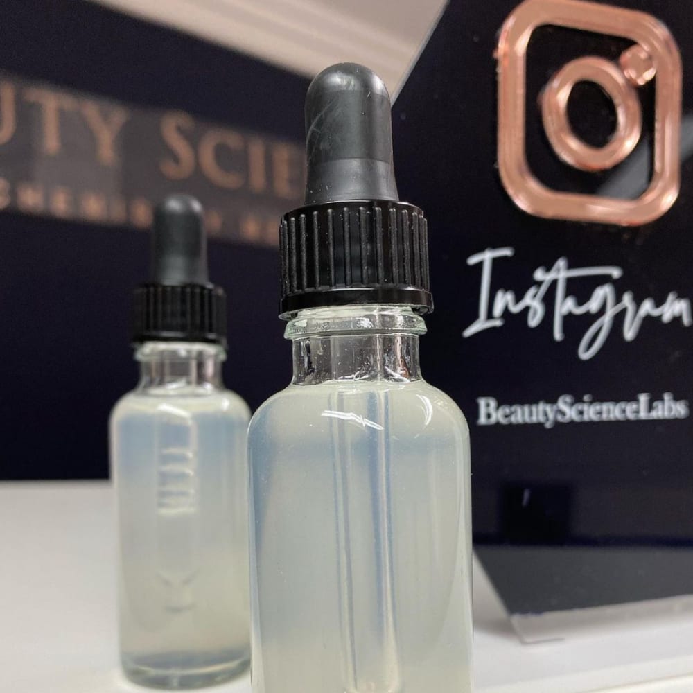 Photo of two bottles with a semi-clear serum inside.