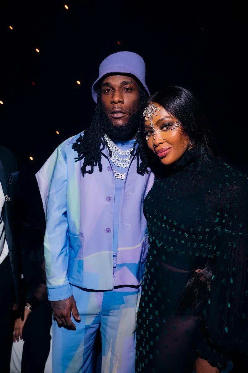 Burna boy standing with Naomi Campbell