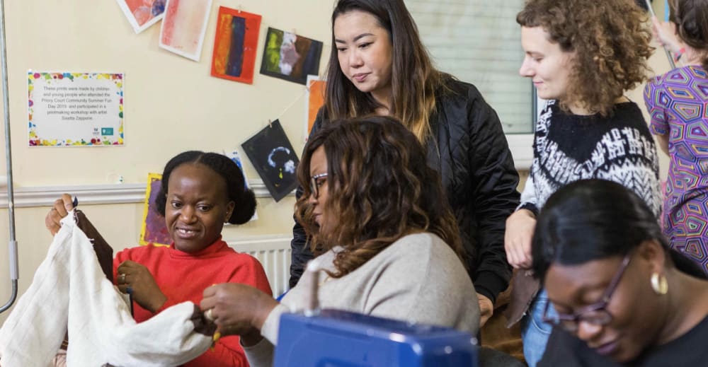 Group of people during a sewing workshop