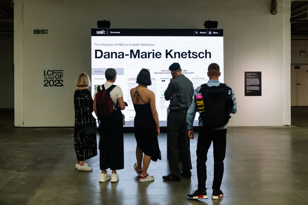 Dana-Marie Knetsch work presented on screen with silhouette of people in front