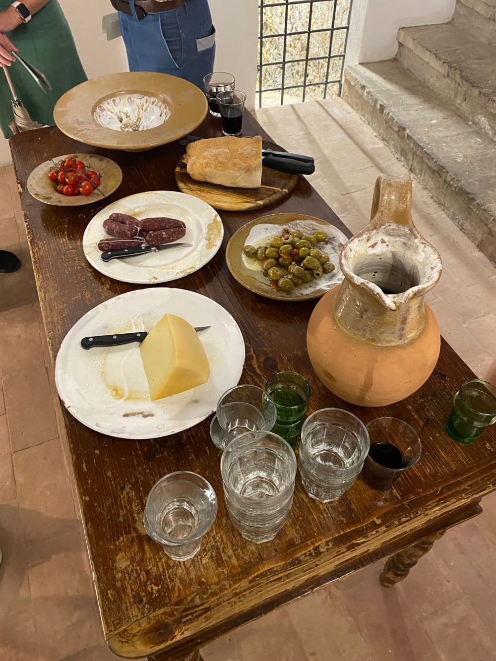 cheese and wine displayed on a table