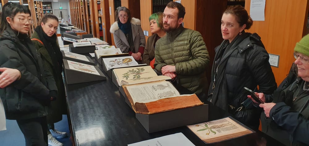 Students viewing highlights from the Illustrations collection at Kew Library and Archives