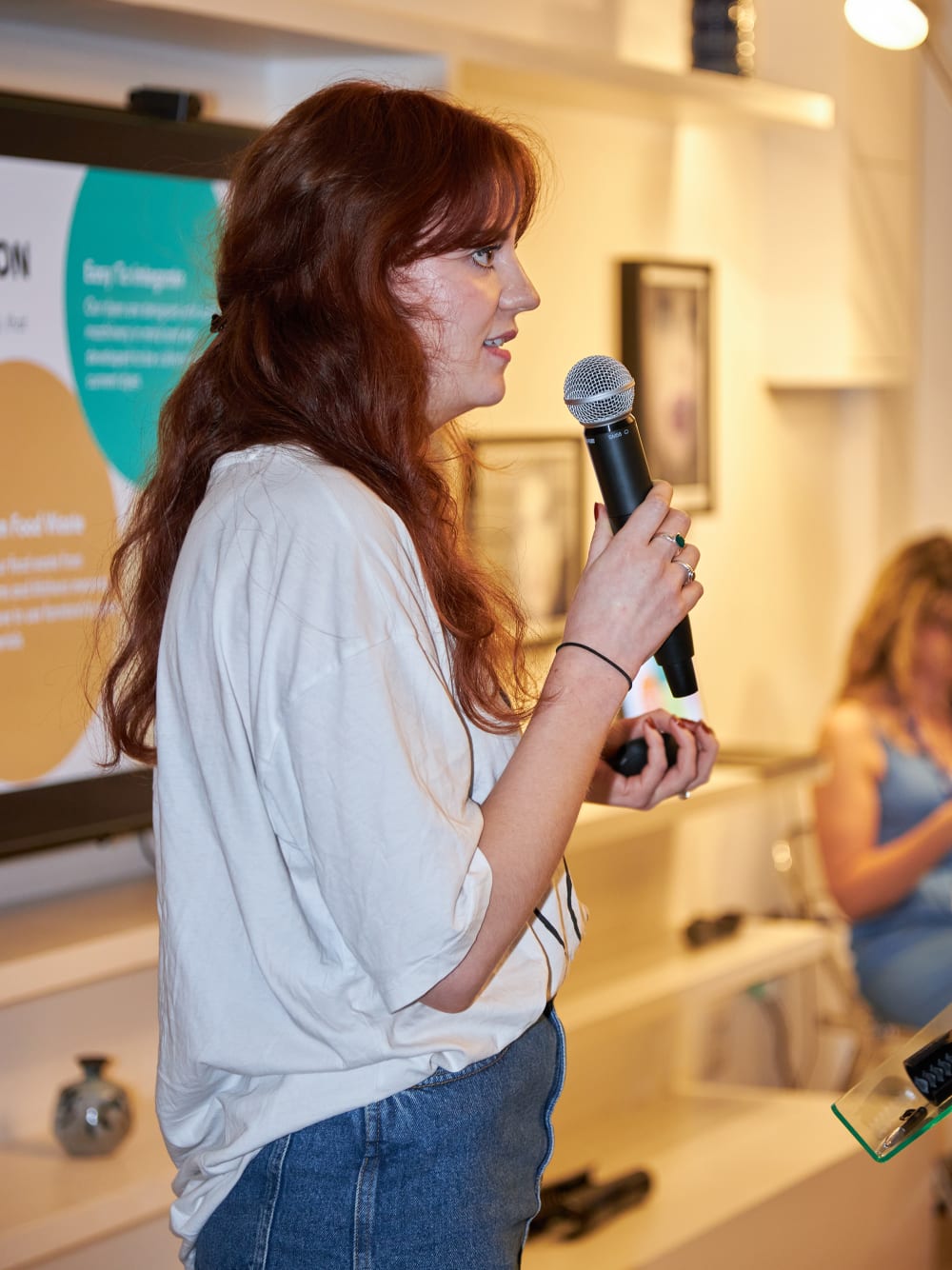 Person speaking into microphone