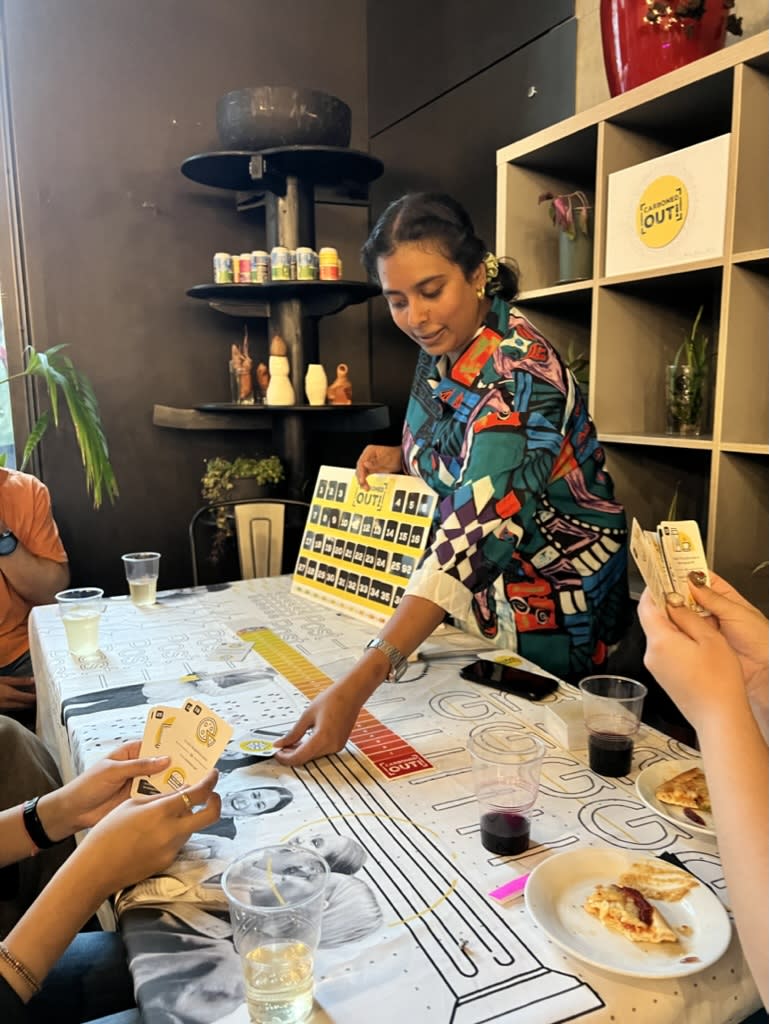 Graduate showcasing interactive game with event guests