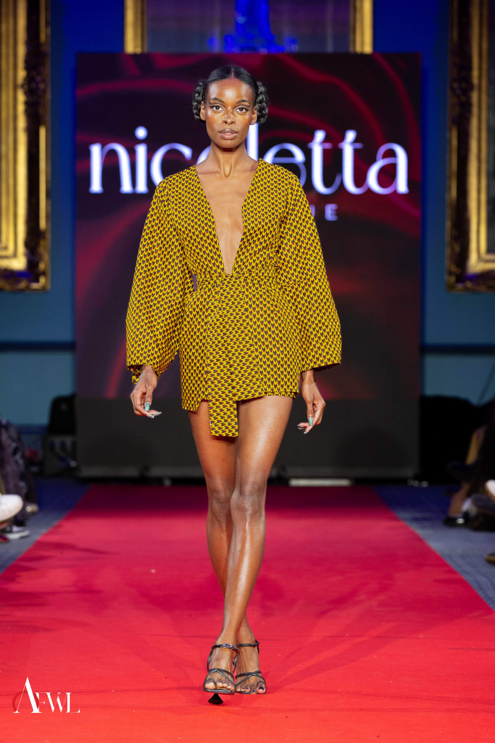 Woman in yellow dress on catwalk