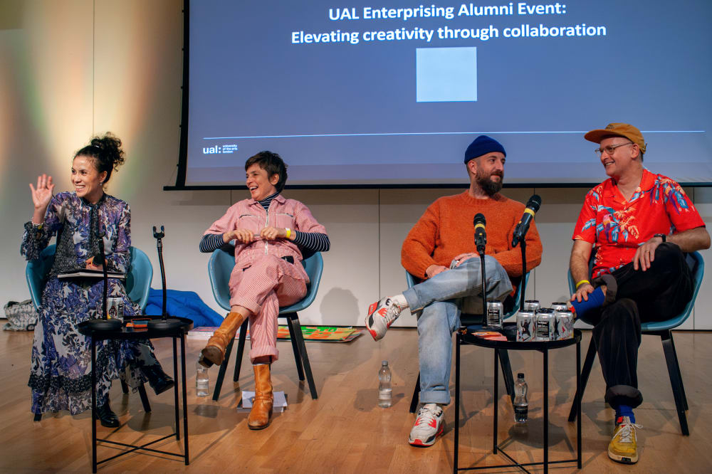 Panellists sitting at the front of the room