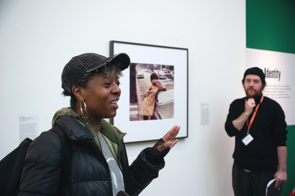 Linett talking,  Karl is standing behind her