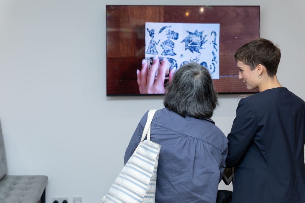 Guests looking at screen 
