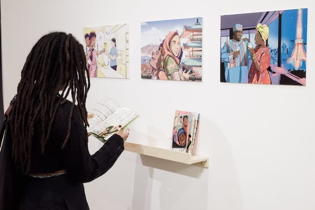 Person looking at artwork on the wall 