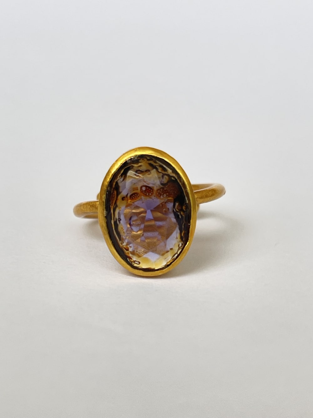 Gold and purple stone ring