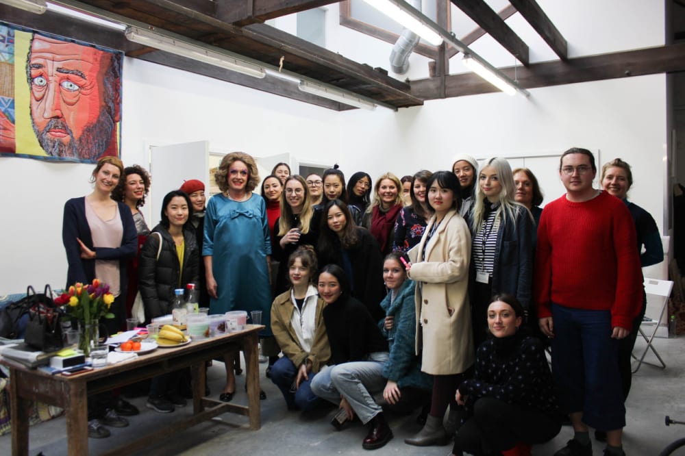 Group shot of Grayson with 30 post-grad students
