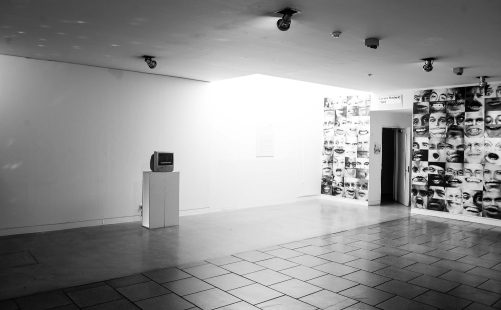 a black and white image of an exhibition space