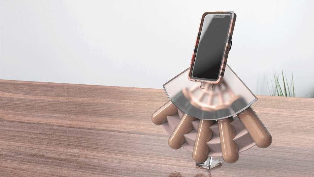 Mobile phone sitting in a stand shaped like a fan