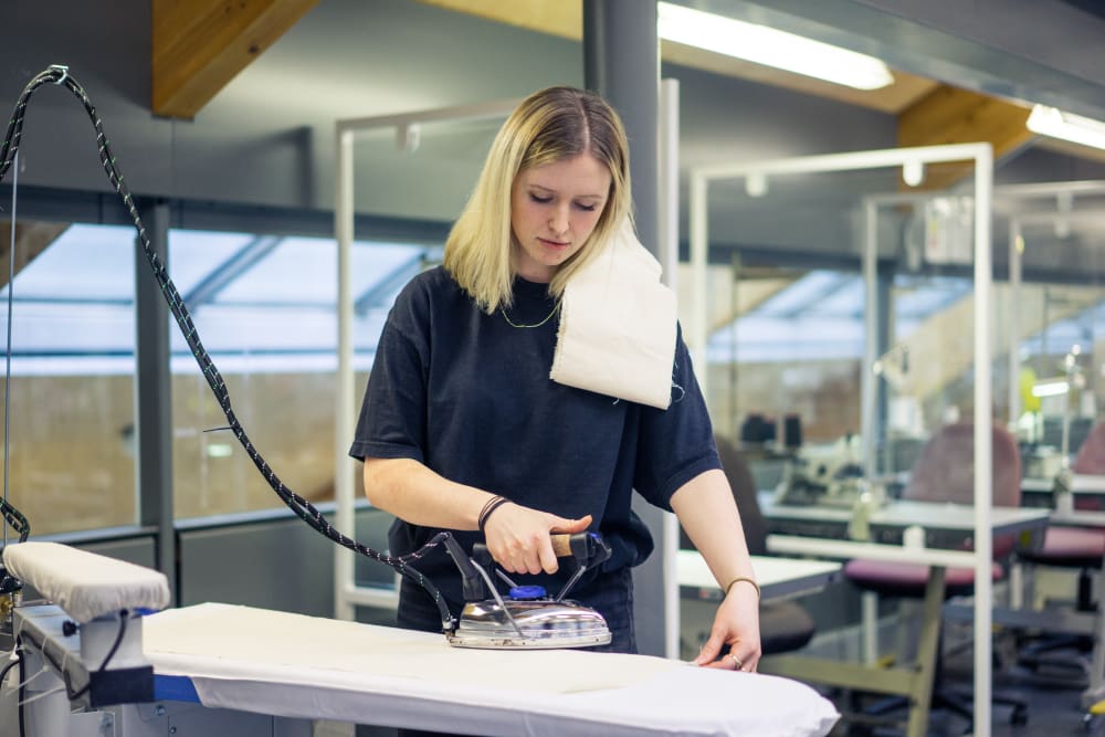 female ironing fabric