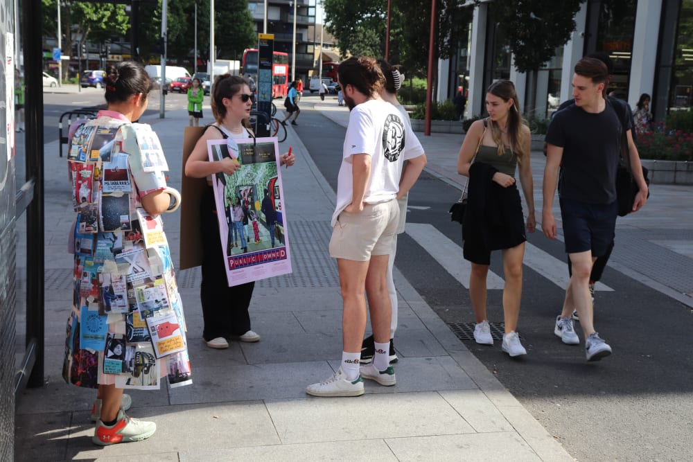 People on the street talking about their project