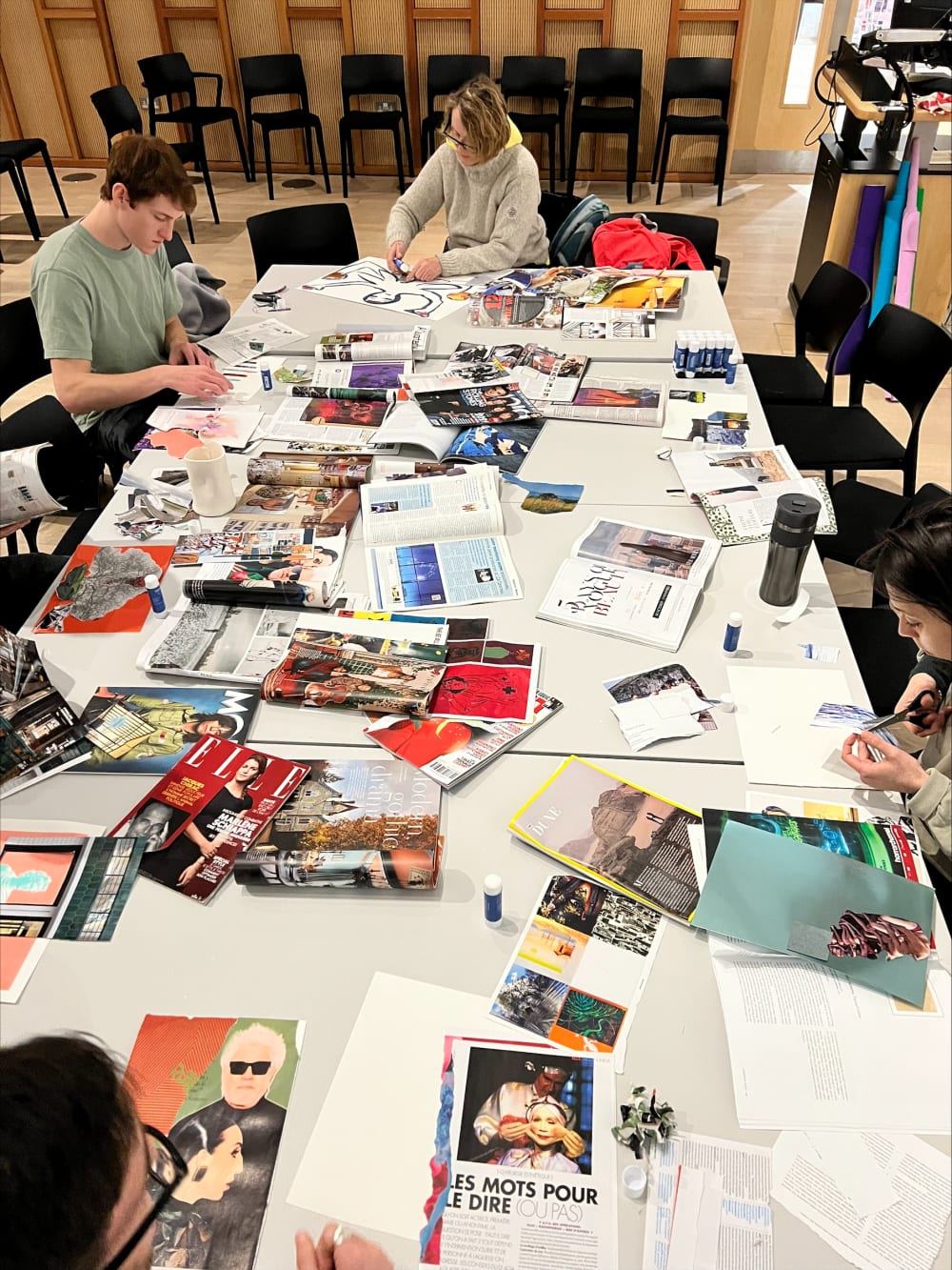 table covered in magazine scraps