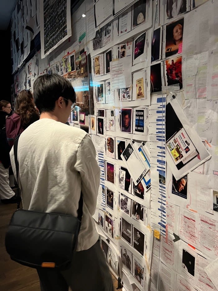 students looking at a photo display
