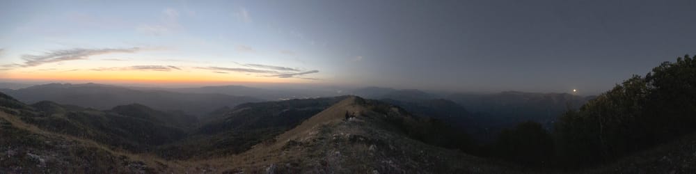 a panoramic photograph of a mountain range