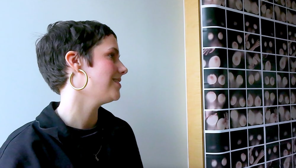 Close-up of Serena's face looking at Harriet Richardson's toilet installation