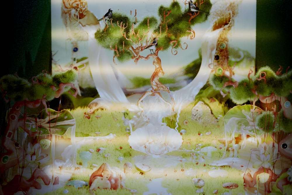 A print of a vibrant landscape with lush green grass and striped orange tree barks. There are various mushrooms and humans emerging from the ground.