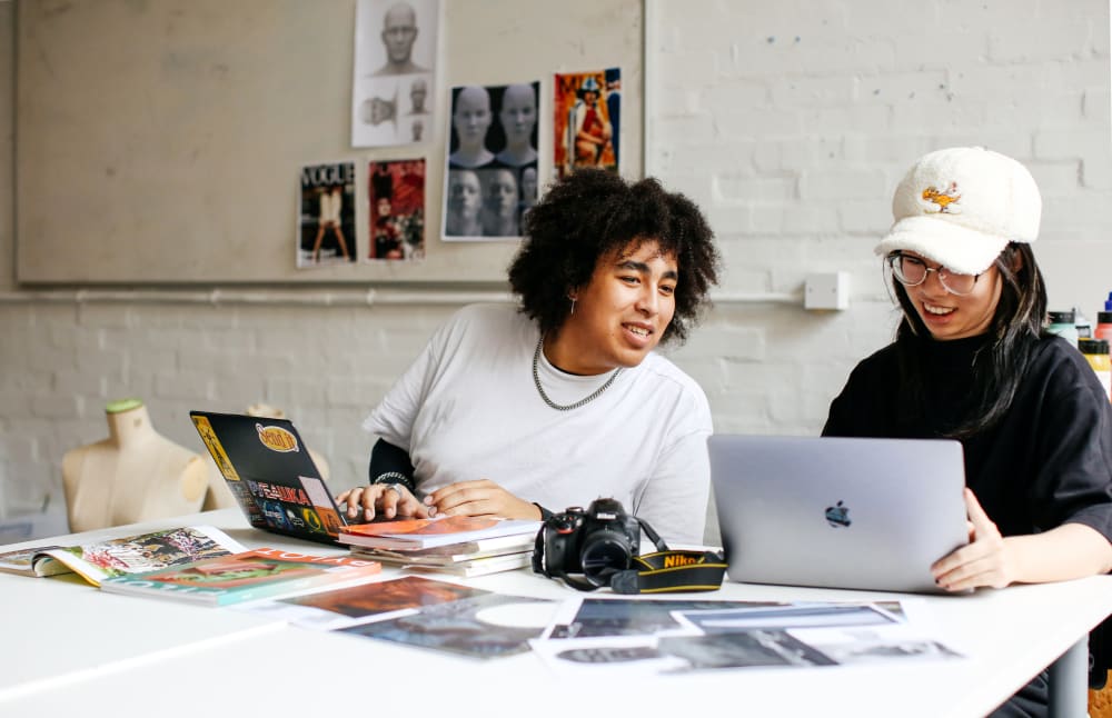 Students collaborating on computer work