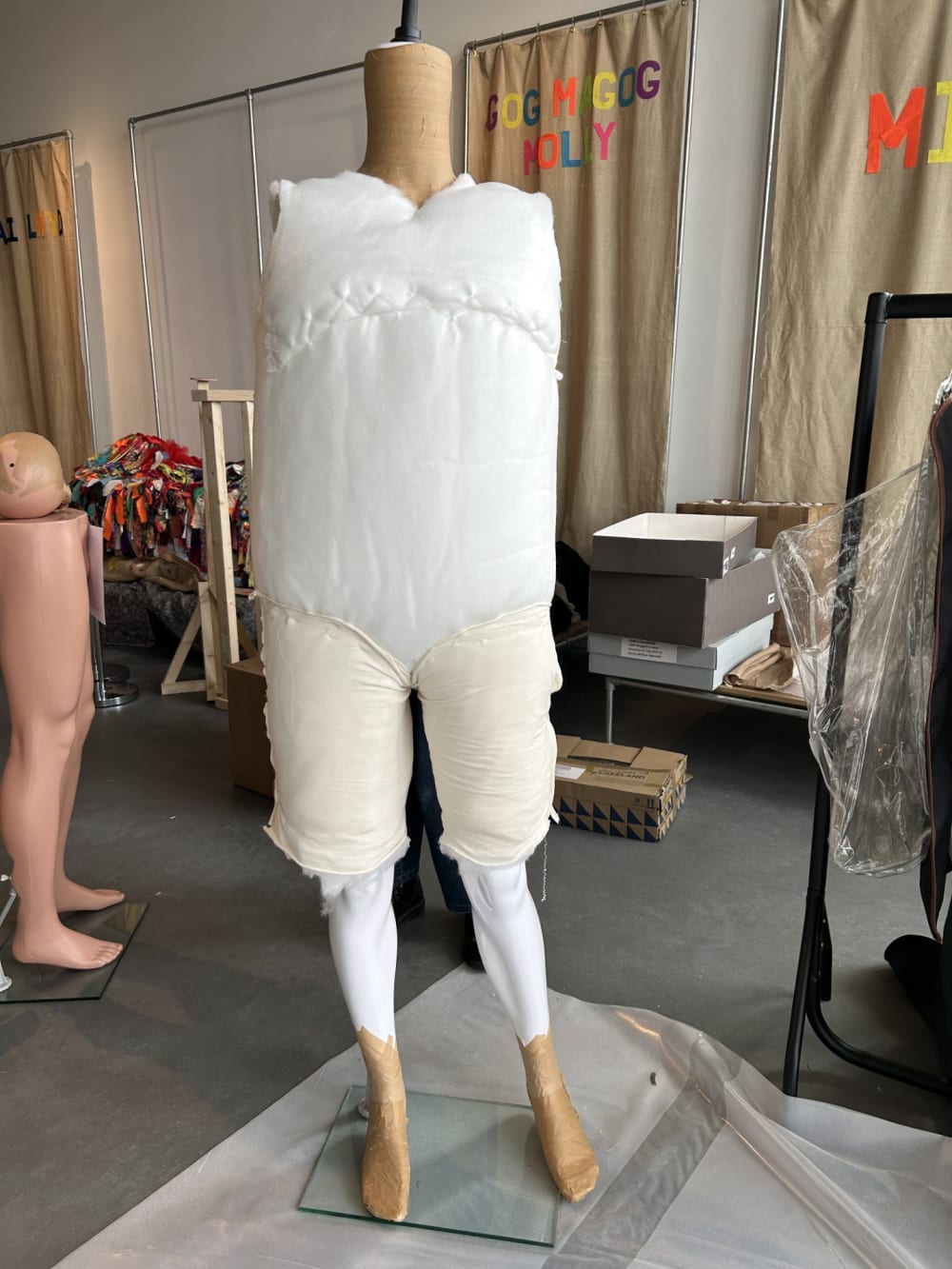 Larry Golding’s mannequin being padded to look large