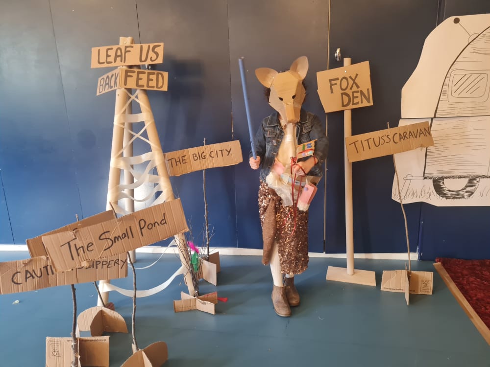 Child dressed up in props to look like a fox.