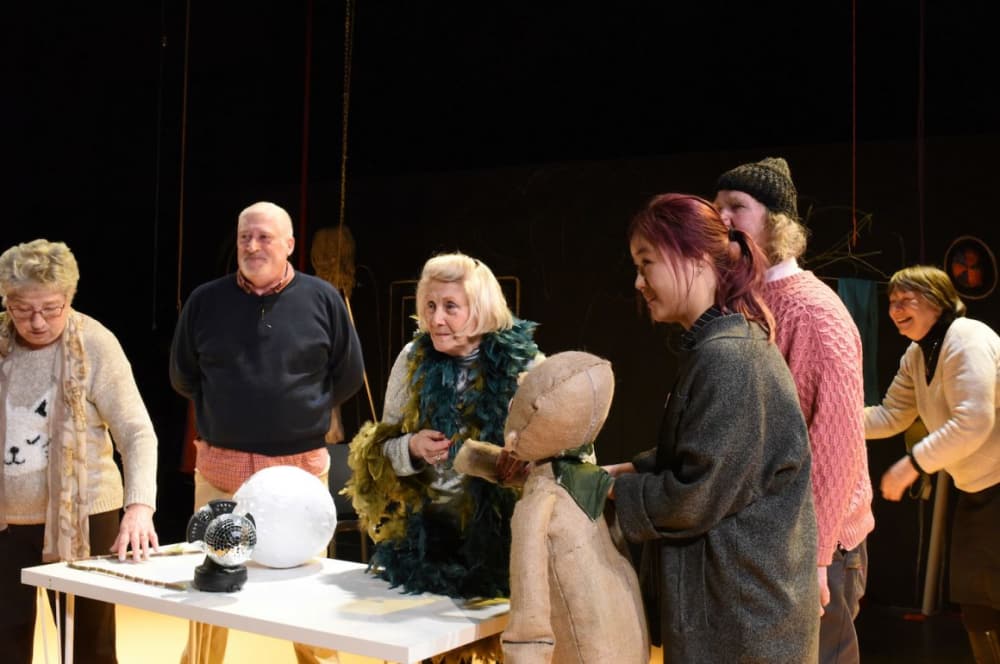 Elderly people and students in a theatre workshop