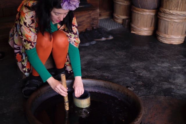 Woman at a dyeing vat