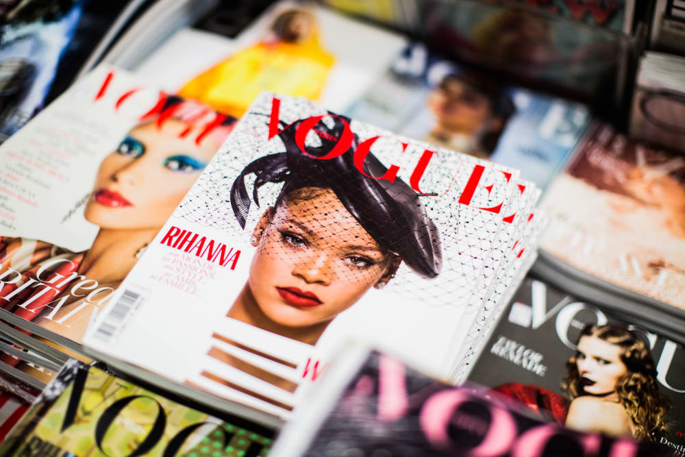 Close up of Vogue covers. The prominent cover features Rihanna.