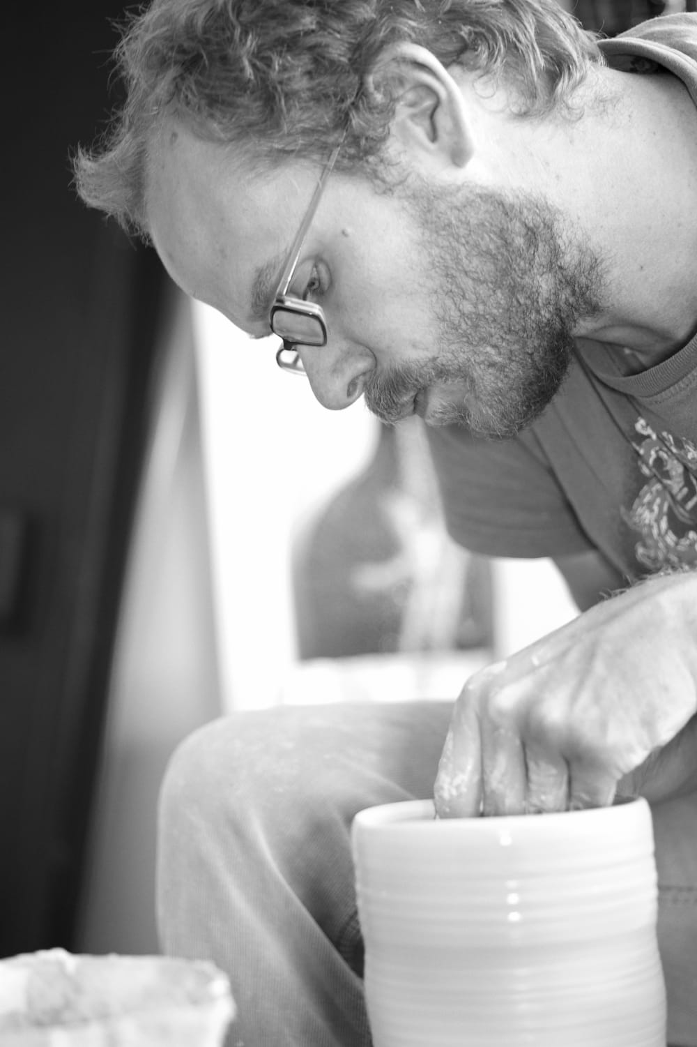Black and white photo of Alex Allpress working