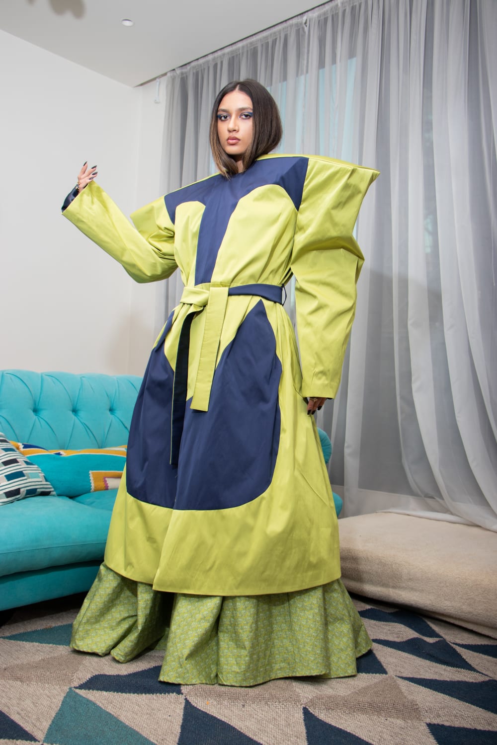 Model wearing Baga Dress and Lori Trench Coat made by Nelson Choga