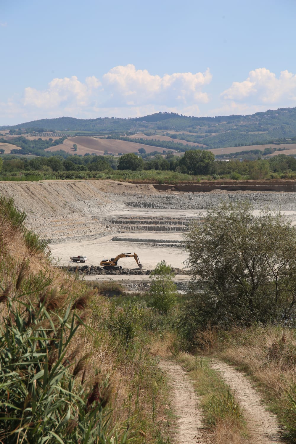 a digger digging up clay
