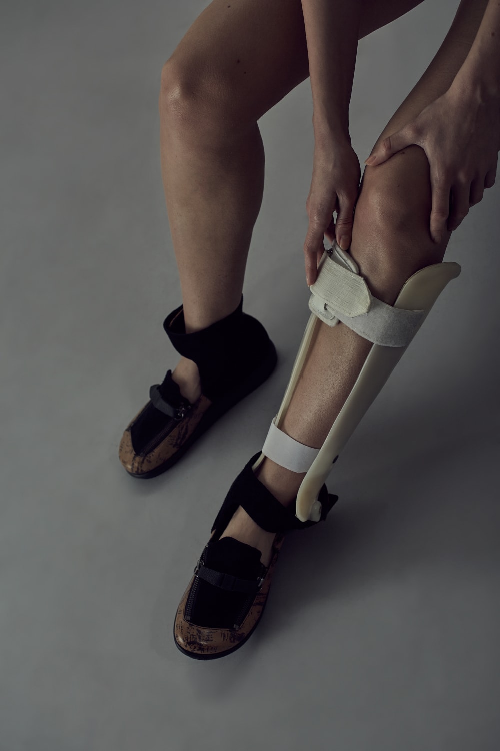 Person's legs with leg brace on