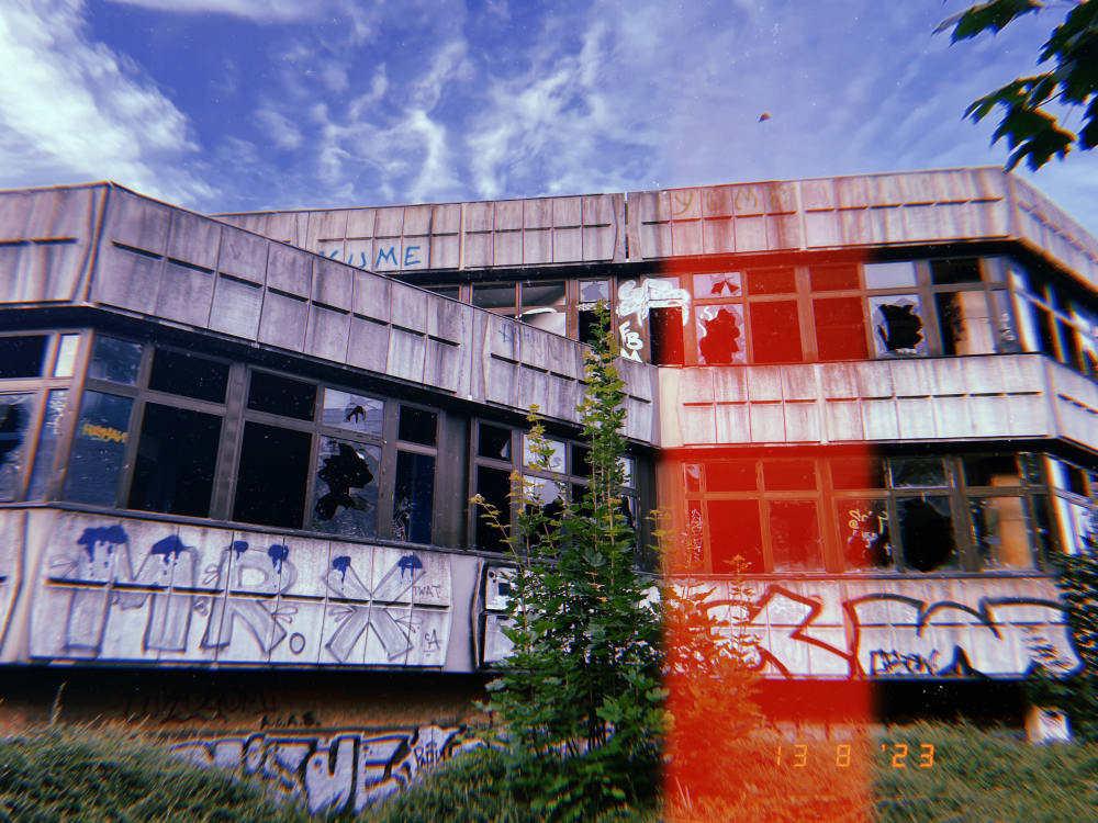 An image of a building with graffiti on it