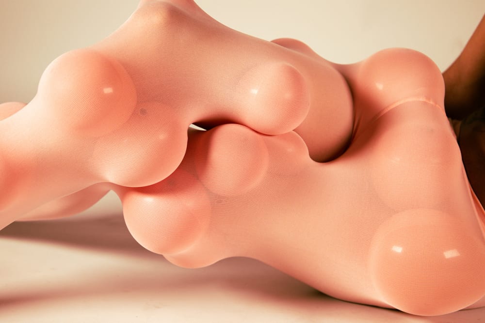 Photograph of someone wearing conceptual textiles.