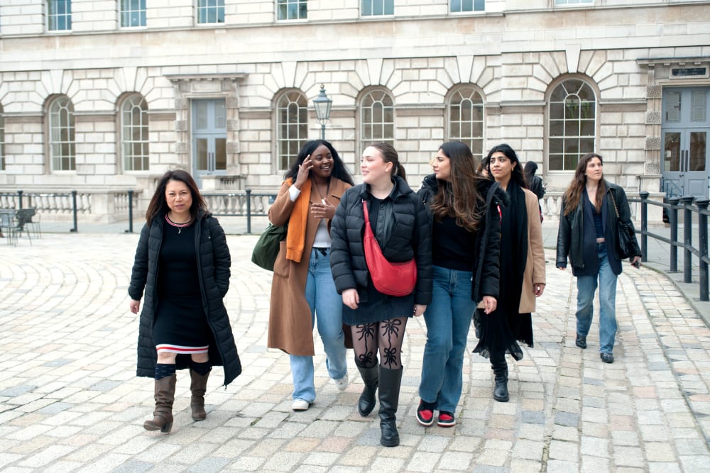 5 people walking in street