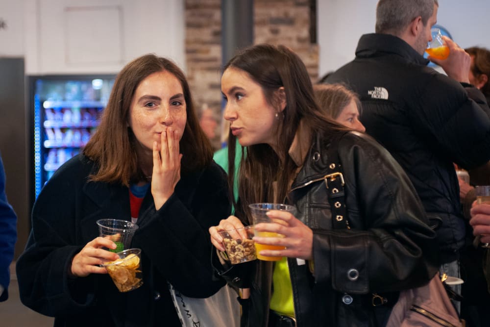 2 women, both with brown hair, pulling faces for the camera