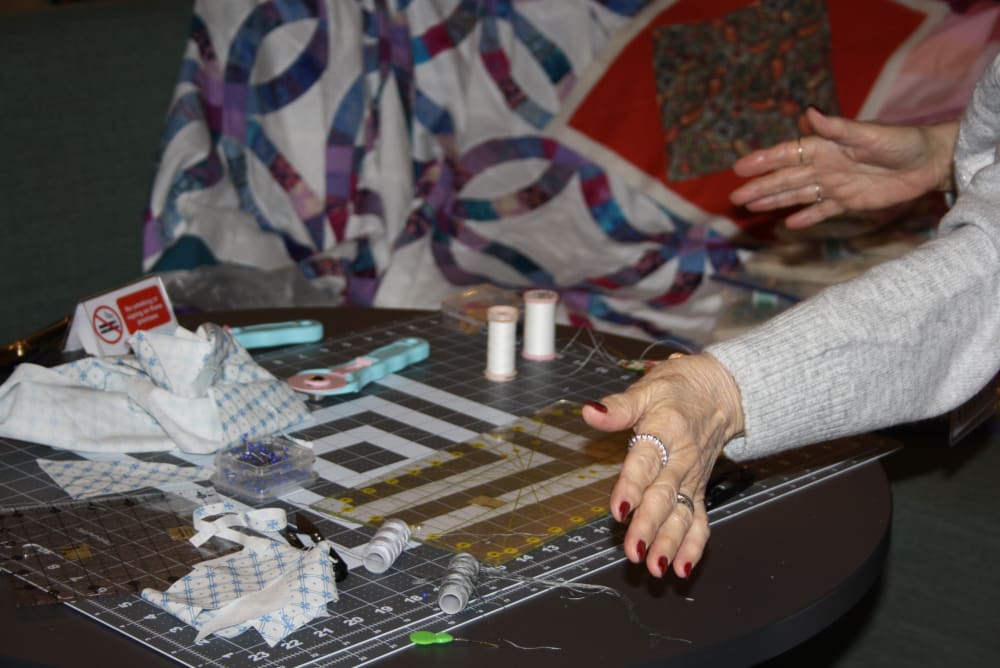 Table with sewing equipment on.