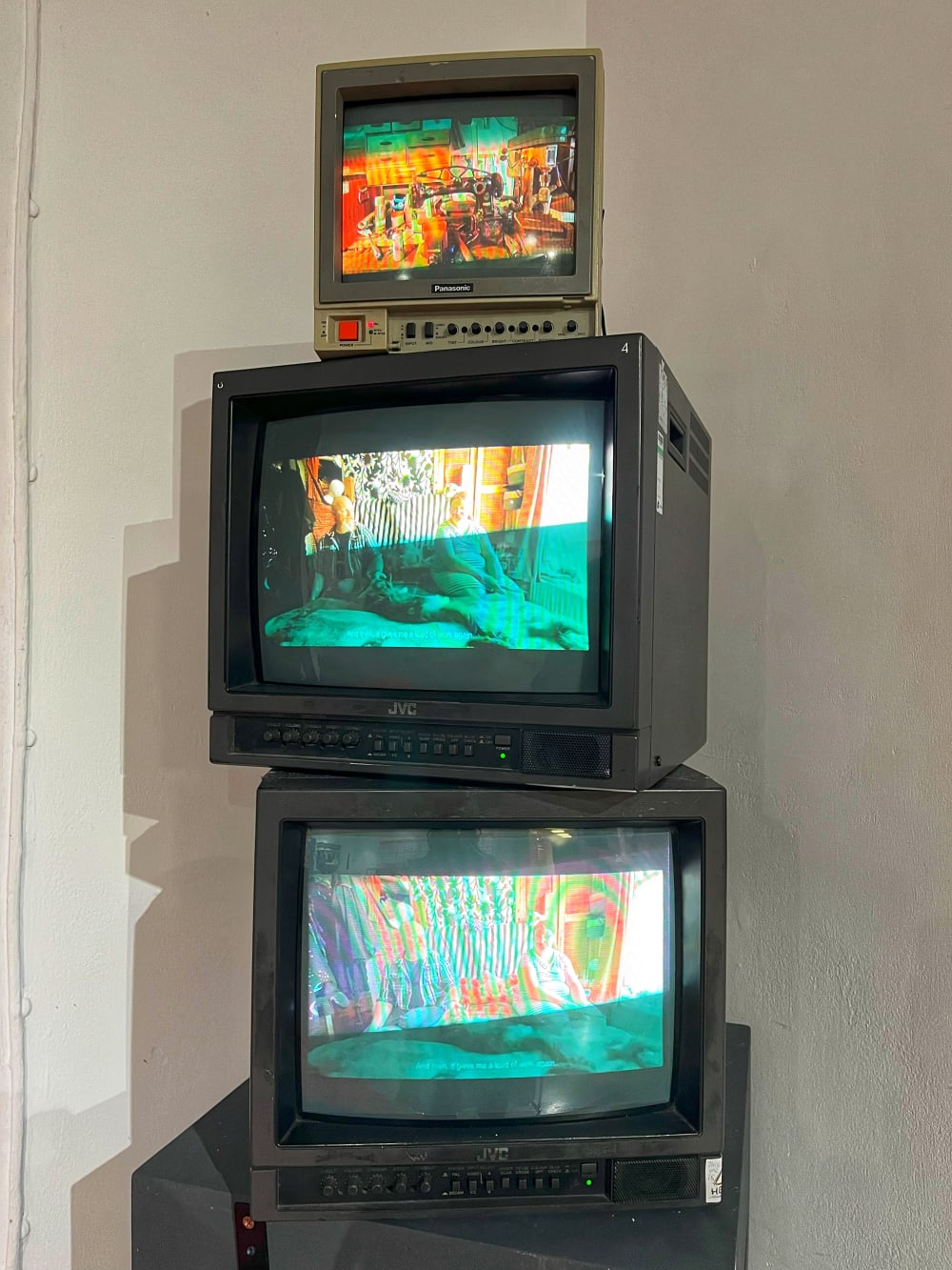 3 retro television units stacked on top of eachother