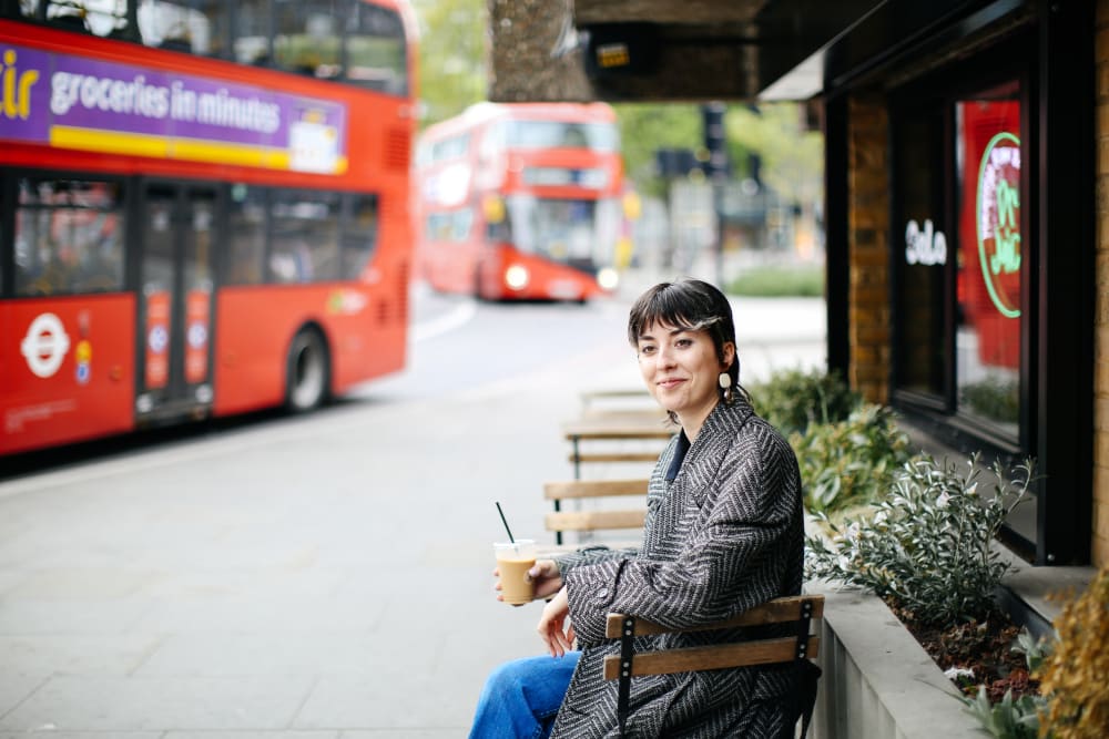 Woman sitting outside a cafe 