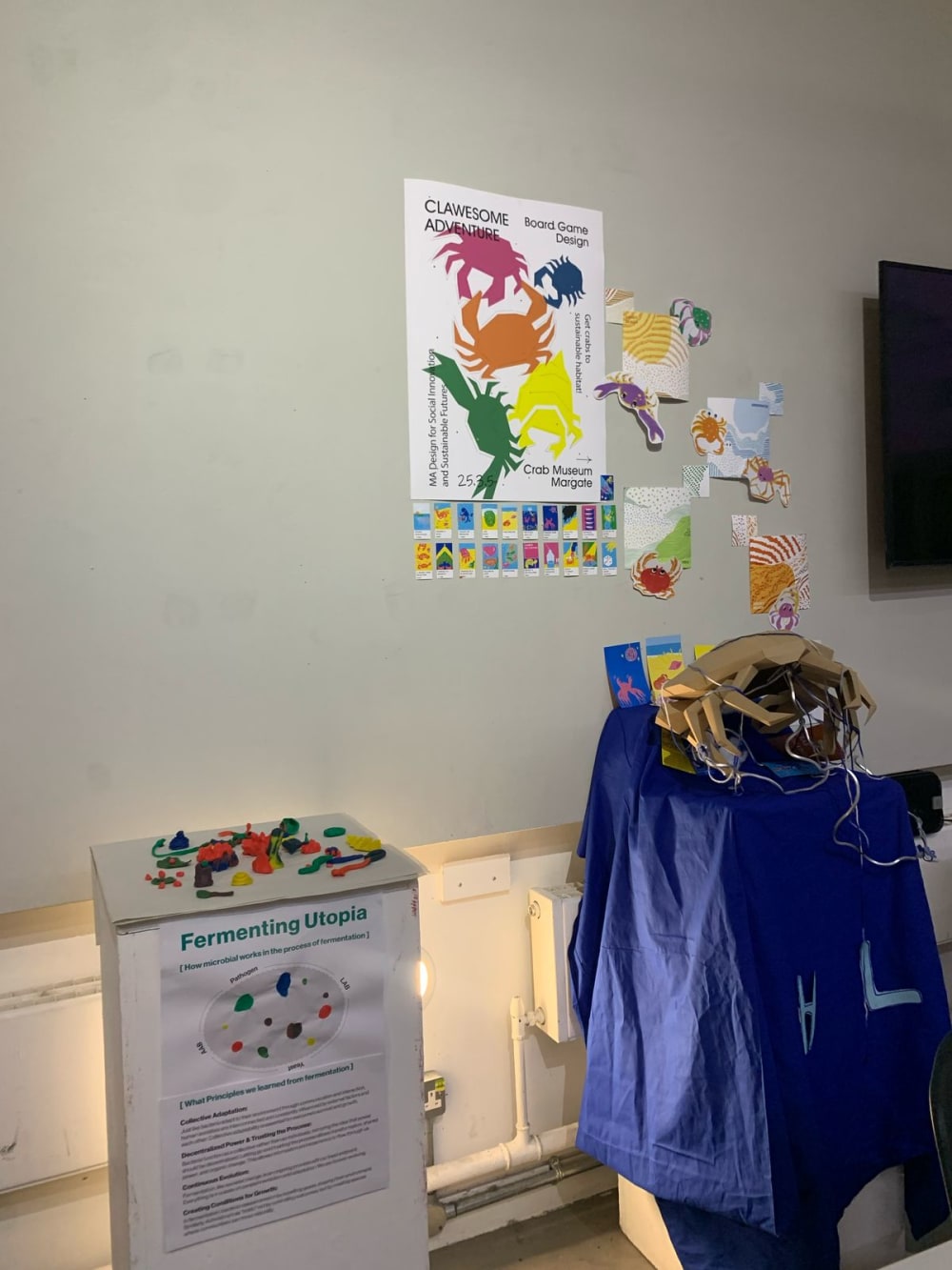 posters with crabs on a wall