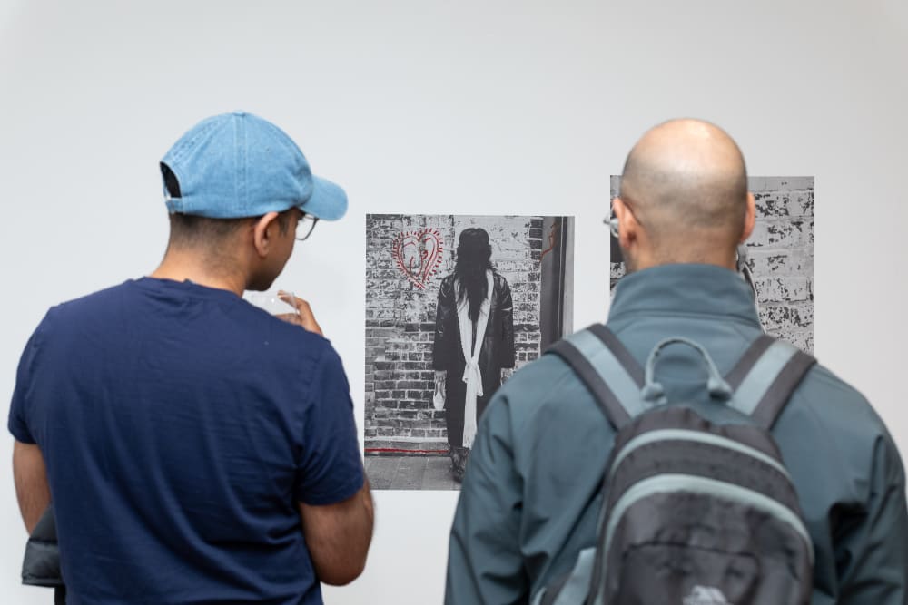 Guests looking at a black and white photo