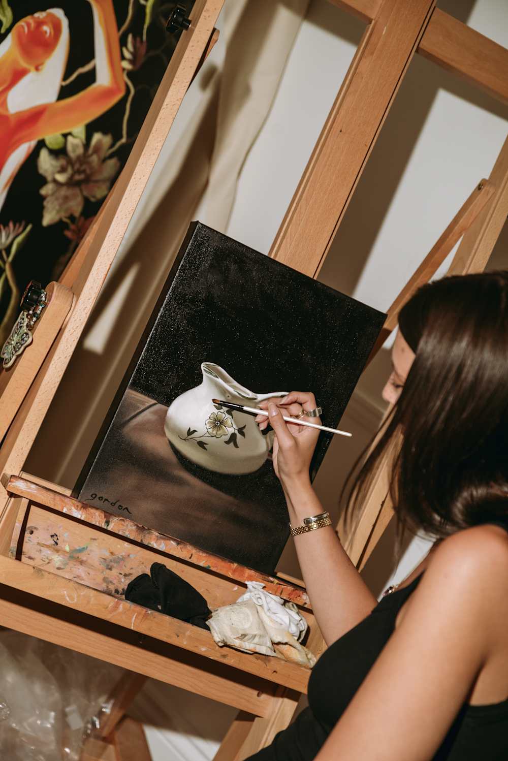 Breanna painting a canvas