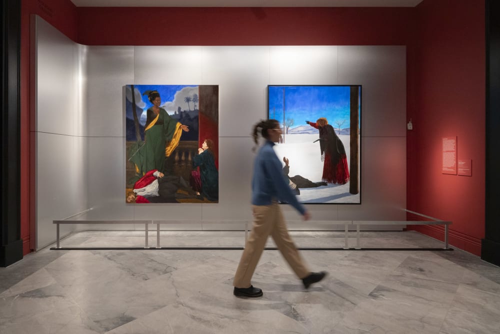 A visitor walks past work by Kimatho Donkor on display at the National Portrait Gallery