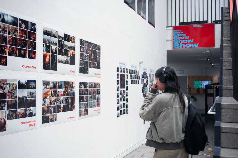 Guest looking at work in the entrance of the building