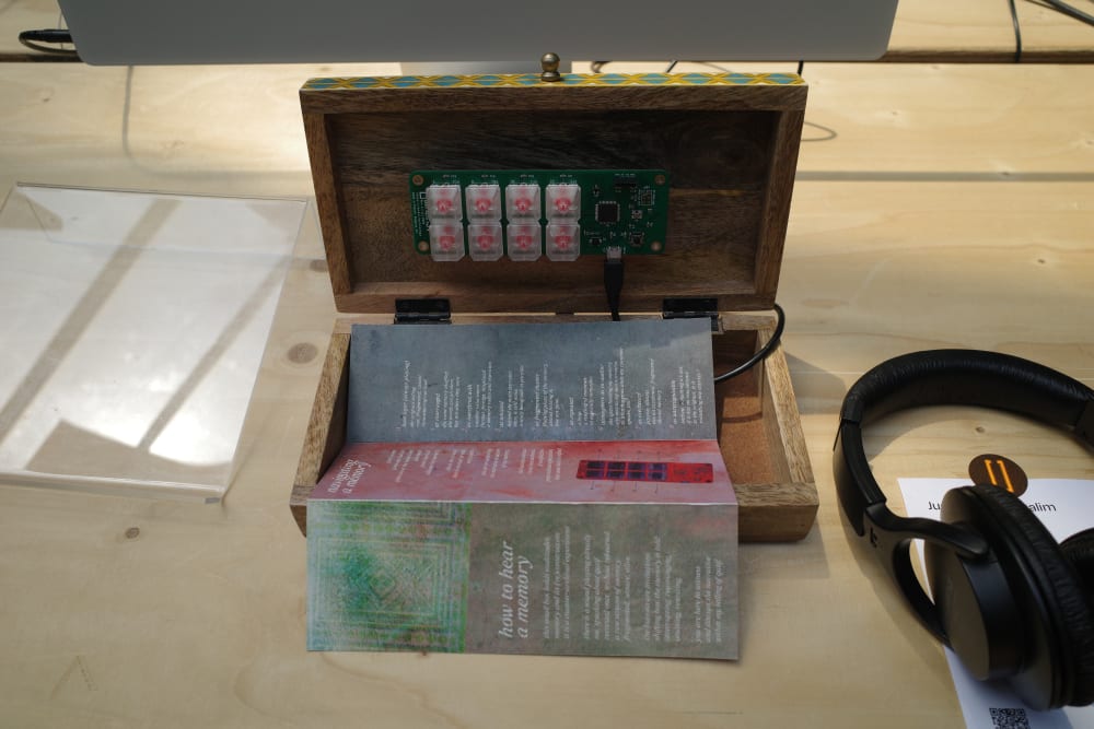 Wooden box with headphones on a table