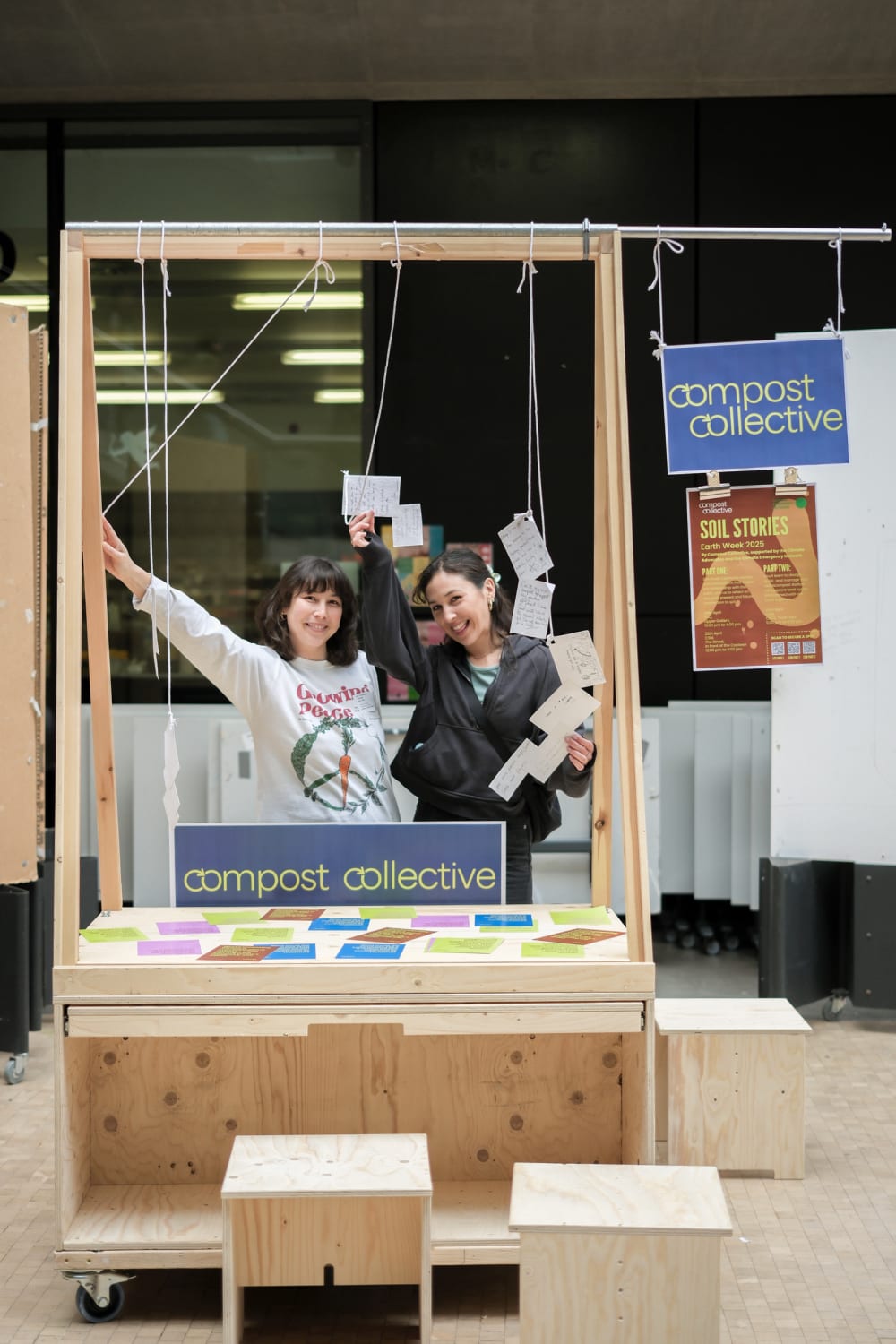 Two members of Compost Collective at their stand in the Street at CSM.